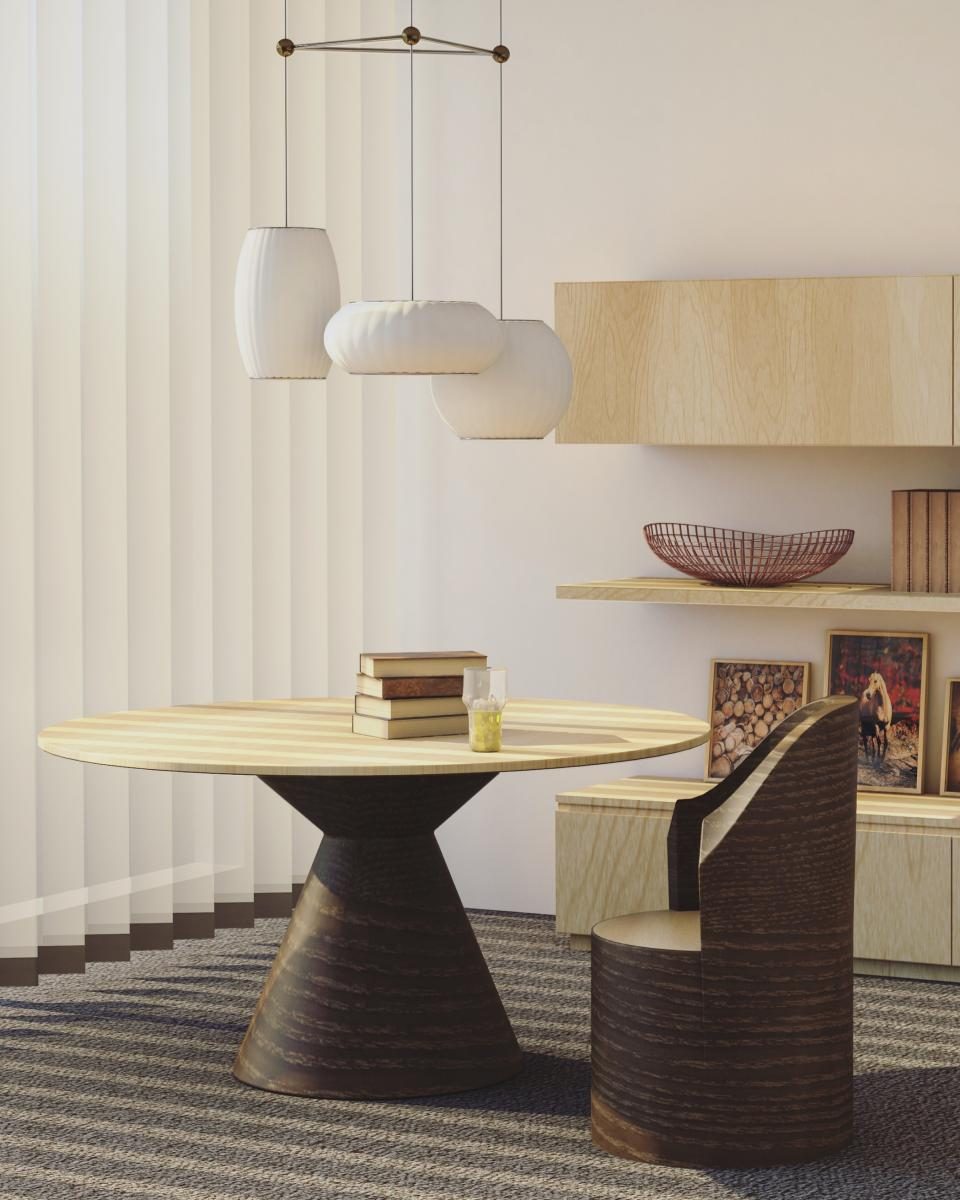 Designed interior with a sculptural table and pendant lighting